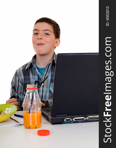 Happy smiling young boy doing studying and homework. Happy smiling young boy doing studying and homework