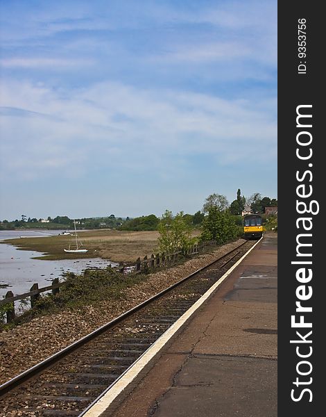 Train approaching platform on coastal railway near exmouth. Train approaching platform on coastal railway near exmouth