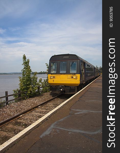 Train arriving platform on coastal railway near exmouth. Train arriving platform on coastal railway near exmouth