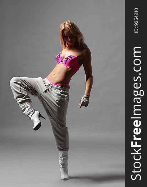 Modern style dancer posing on studio background. Modern style dancer posing on studio background