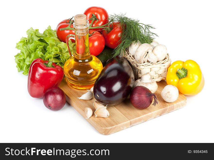 Still-life with fresh vegetables on a white background.