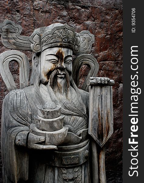 The wood statue of God of Wealth, who can bring the fortune to the people in Chinese tale.