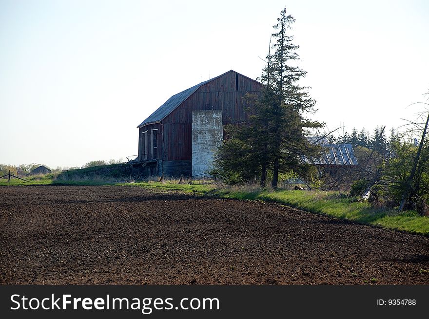 A view of a farm during an early morning commute along 9th line in Halton Hills Ontario, Canada. A view of a farm during an early morning commute along 9th line in Halton Hills Ontario, Canada