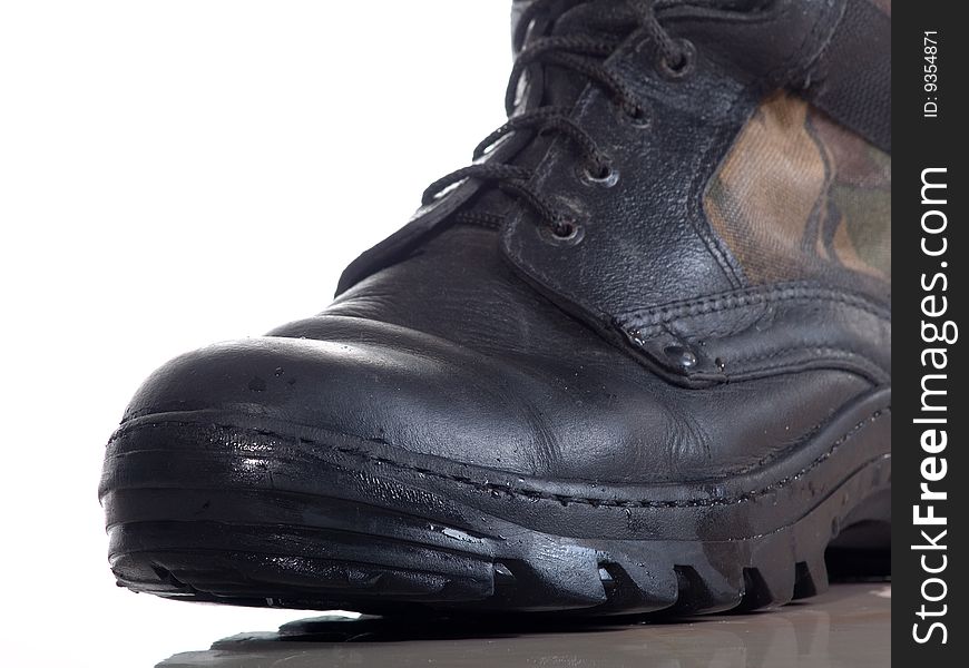 Wet leather boot on white background