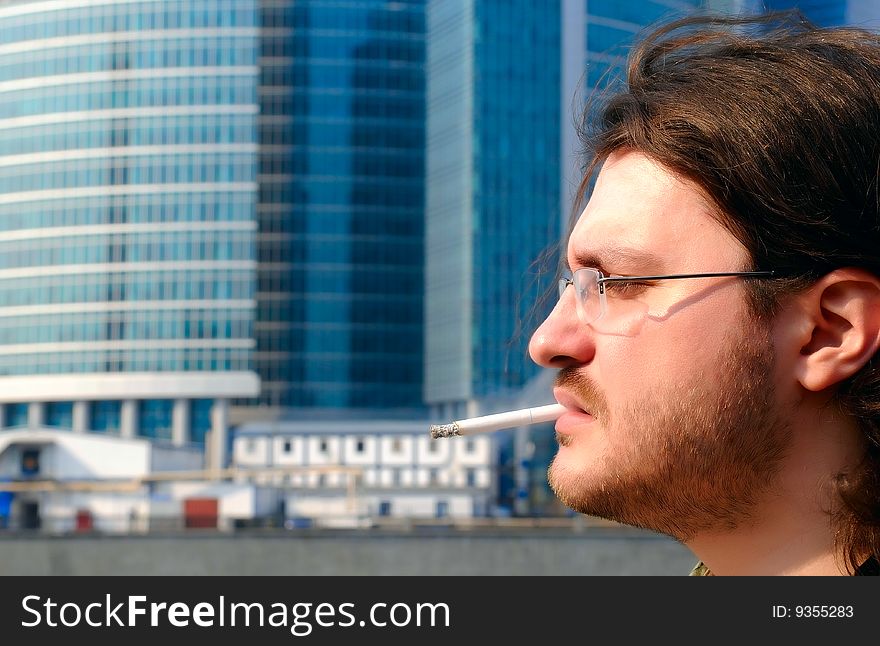 Smoking men in front of skyscraper