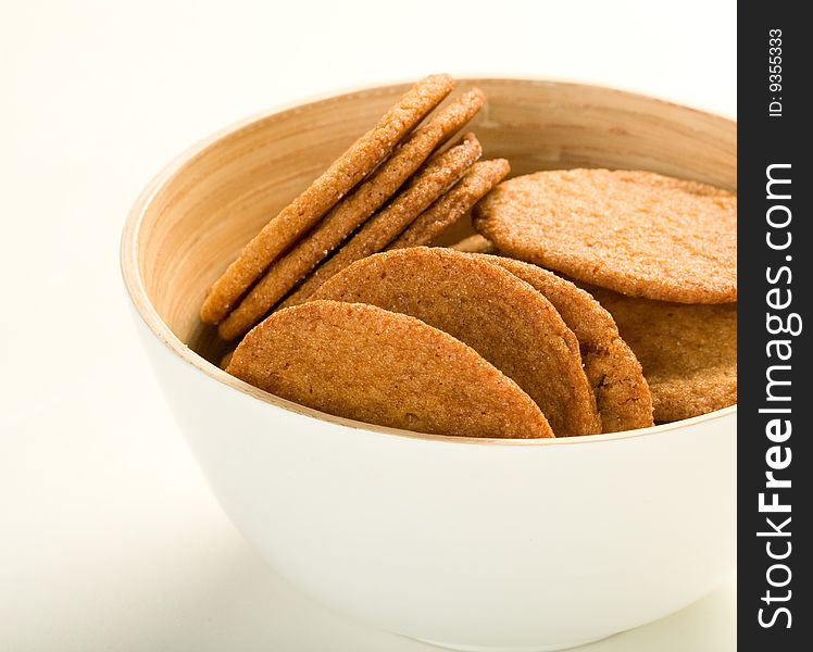 Ginger cookies in white bamboo bowl. Ginger cookies in white bamboo bowl