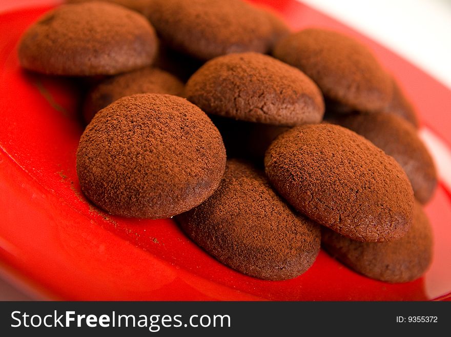 Chocolate truffle cookies on red plate