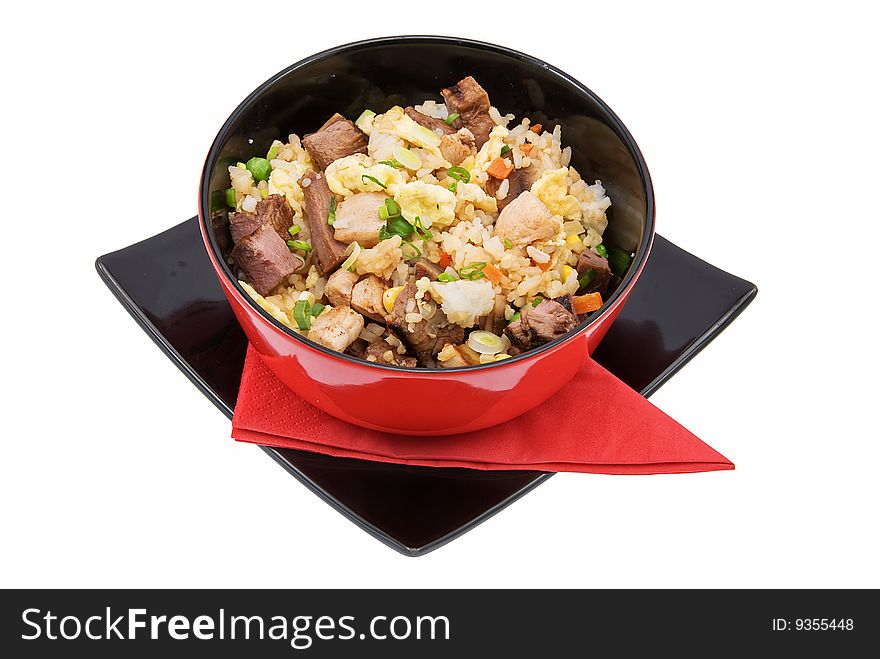 Black plate with rice and meat on white. Black plate with rice and meat on white