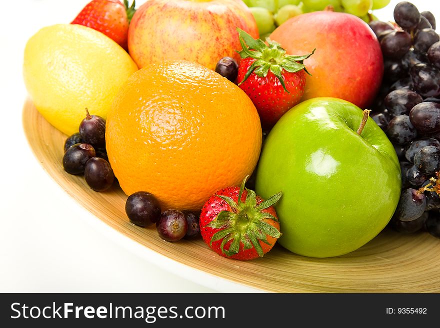 Fruit platter stocked with apples, orange, lemon, grape, strawberry and mango. Fruit platter stocked with apples, orange, lemon, grape, strawberry and mango