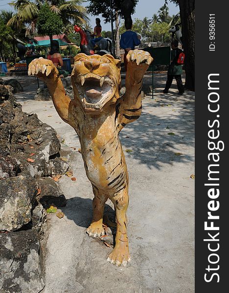 Tiger. A sculpture in paradise and hell temple. Thailand.