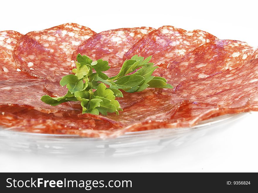 Salami, sliced and arranged on a plate