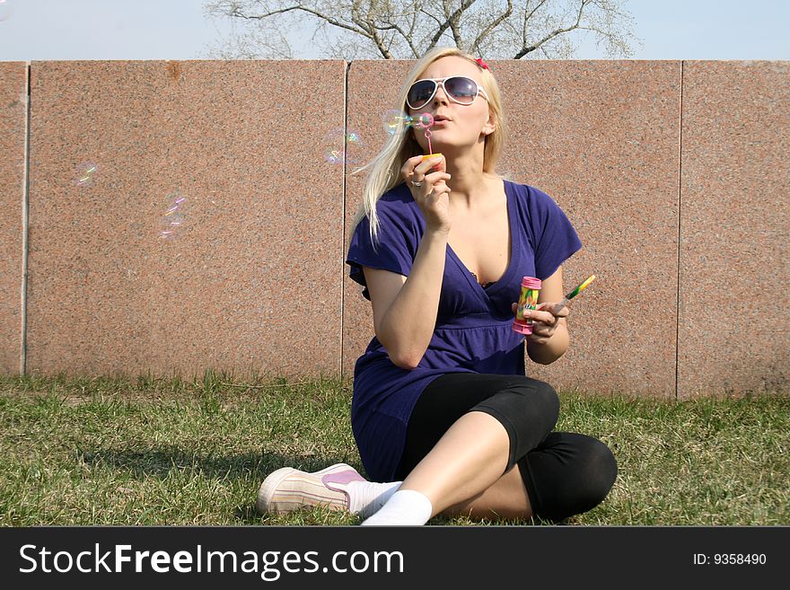 Girl Blowing Soap Bubbles