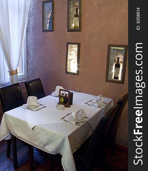 Table with cutlery, plaits and glasses in Restaurant. Table with cutlery, plaits and glasses in Restaurant