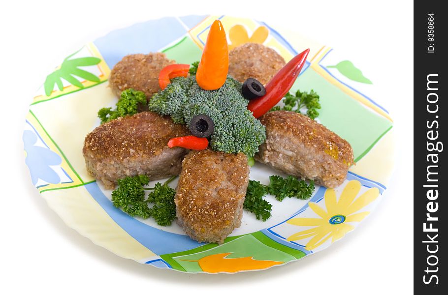 Meat rissoles on plate with broccoli and chilly