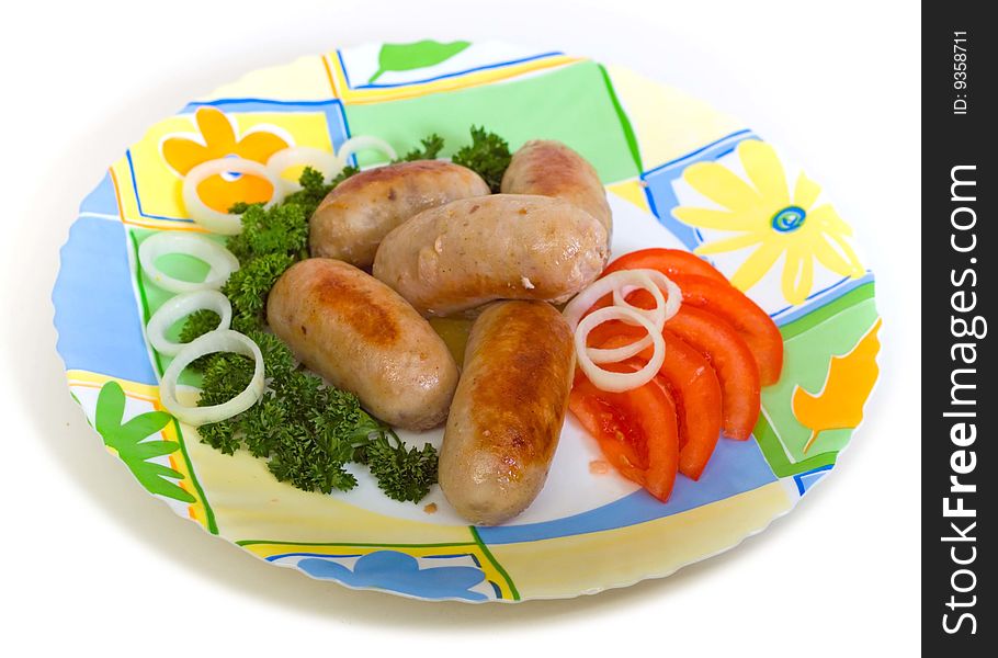 Meat cutlets with tomato on a round plate. Meat cutlets with tomato on a round plate