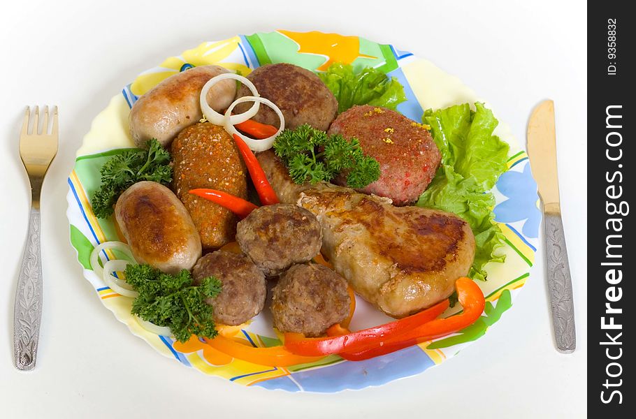 Meat cutlets and small sausage