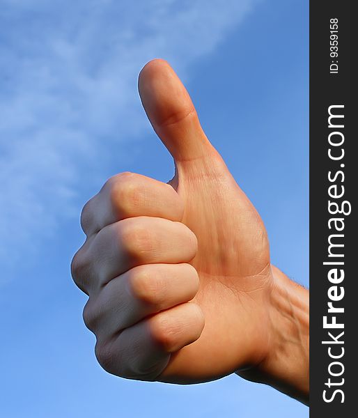 Hand on blue sky background. Hand on blue sky background