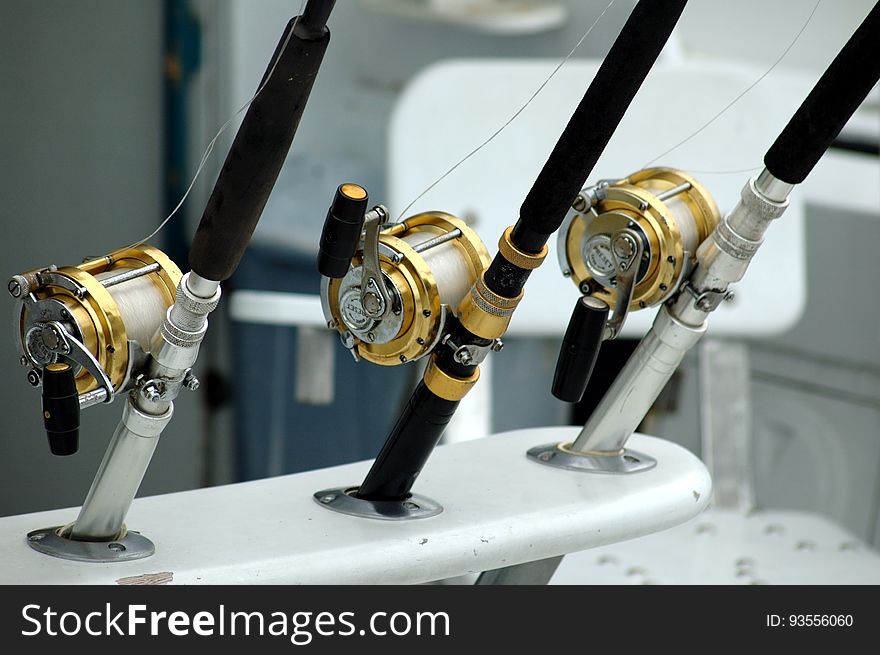 3 Lined Brass and Black Fishing Reel