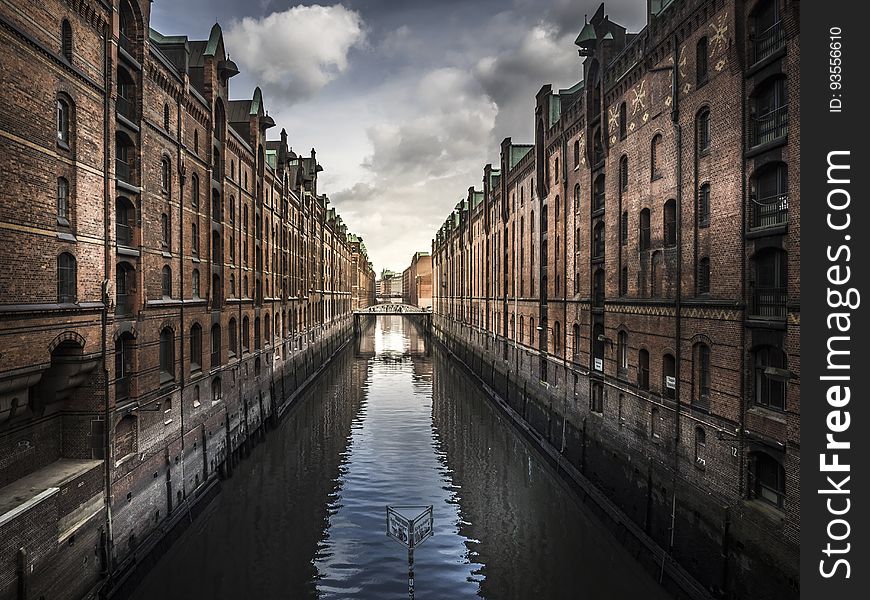Buildings Reflecting In Canal