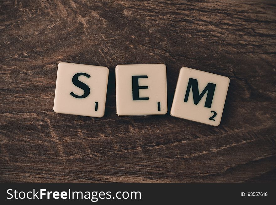 Letters blocks spelling search engine marketing acronym SEM on wooden background. Letters blocks spelling search engine marketing acronym SEM on wooden background.