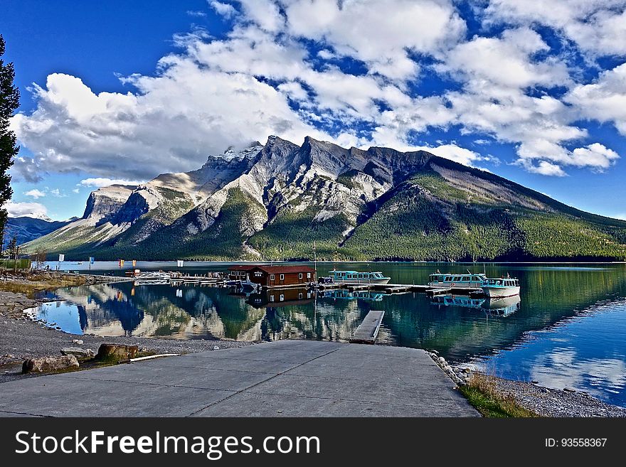 A mountain landscape with a marina in front. A mountain landscape with a marina in front.