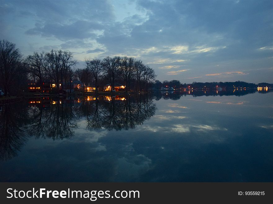 Houses by shore of lake