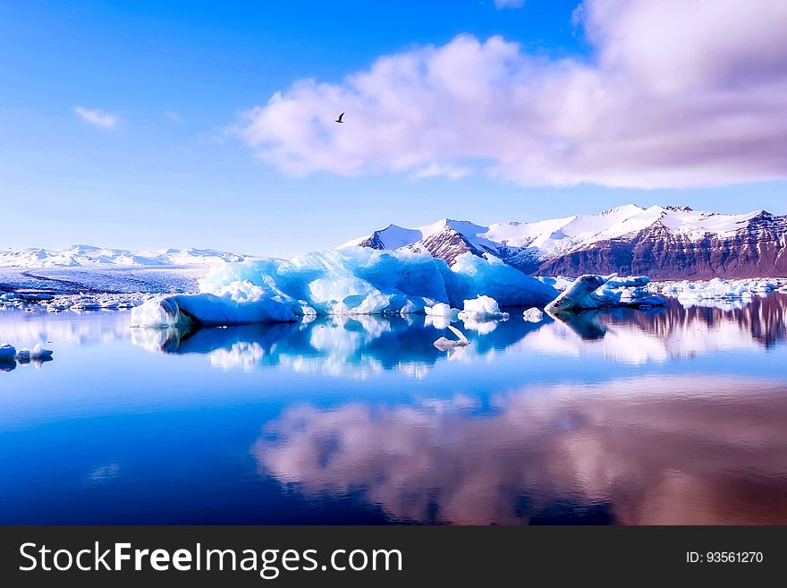 A beautiful lake surrounded by icebergs and mountains. A beautiful lake surrounded by icebergs and mountains.
