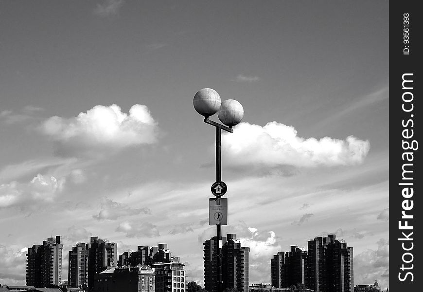 A black and white photograph of city with a street light. A black and white photograph of city with a street light.
