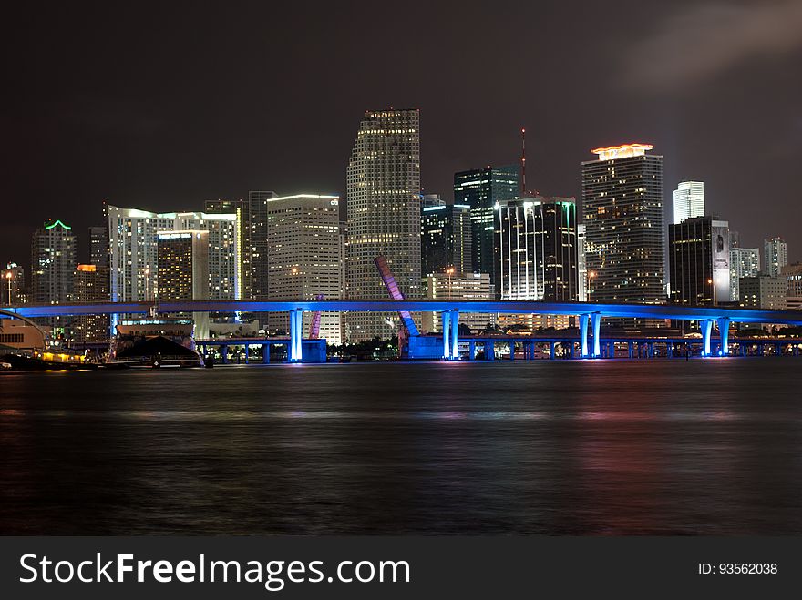Lights of city skyline illuminated at night in Miami, Florida. Lights of city skyline illuminated at night in Miami, Florida.