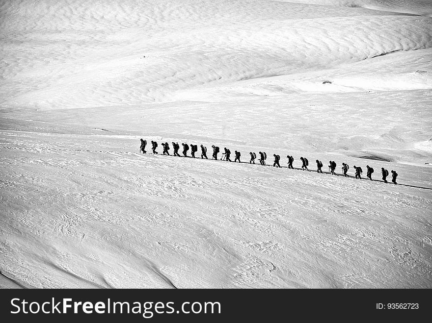 People Walking on Snow Field Grayscale Photography