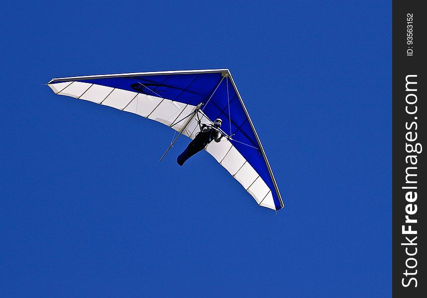 Man on Blue and White Air Glider