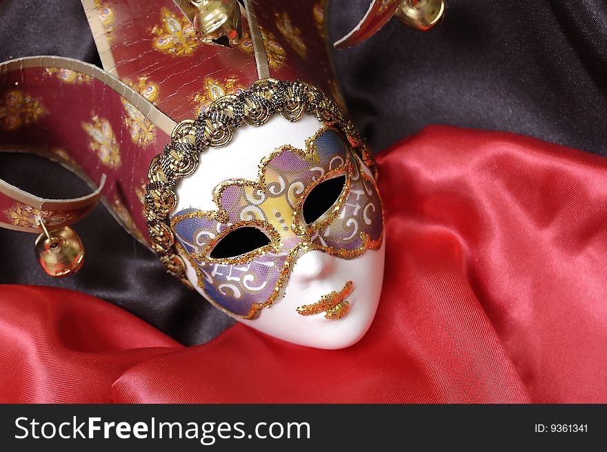 Venetian mask on a red background