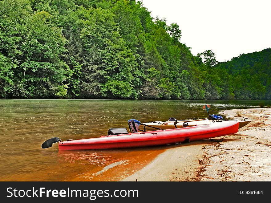 Kayaks On The River Beach Area