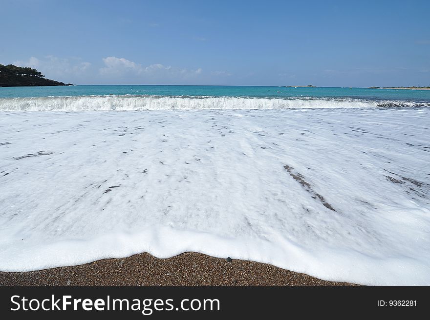 Beach with waves crashing into the shore