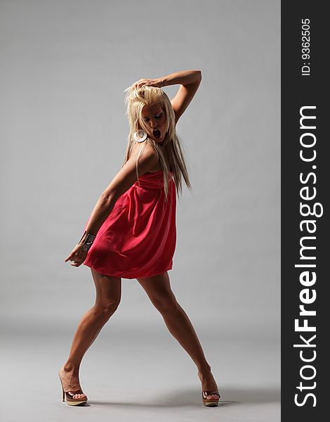 Modern style dancer posing on studio background. Modern style dancer posing on studio background