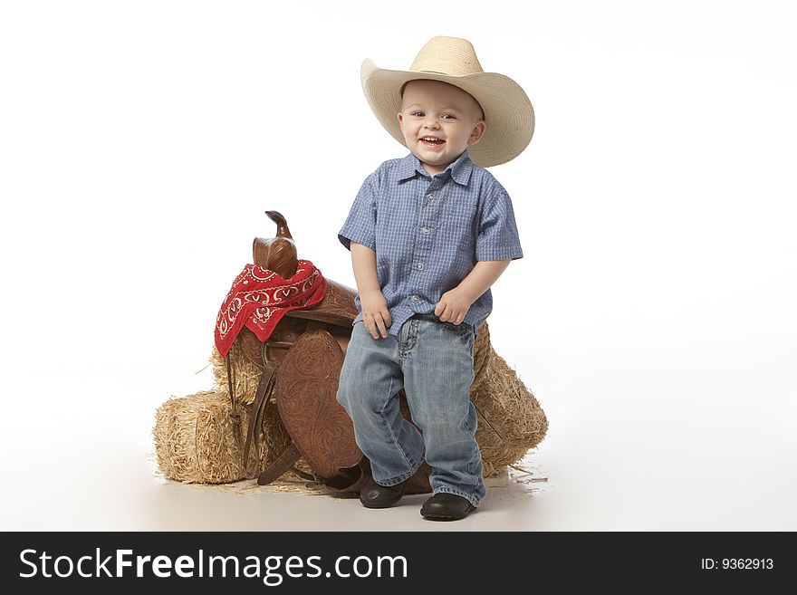 Little boy on white with cowboy hat on white background. Little boy on white with cowboy hat on white background.