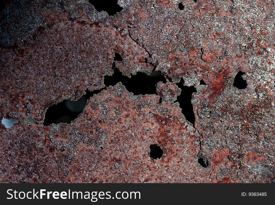 Rusty barrel texture under contrast sunlight reflex