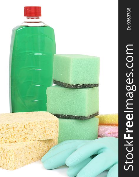 Variety of cleaning products - sponges, gloves, and bottle with chemicals isolated on white background