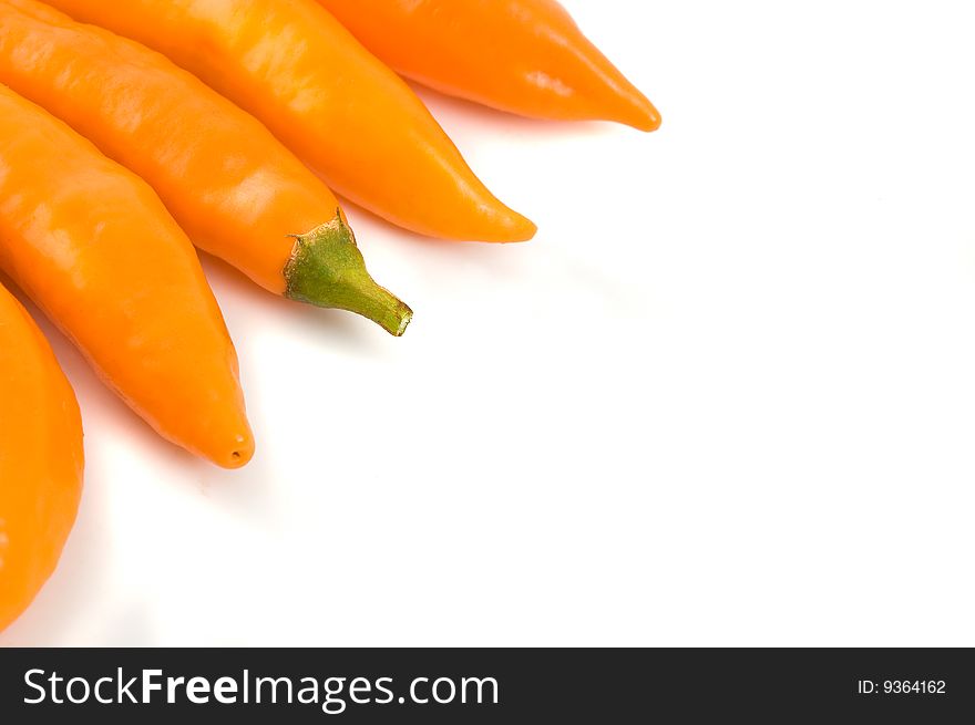 Group of chilli peppers on white background, close up.