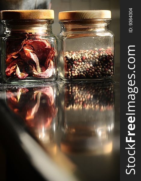 Small jars with coloured pepper. Small jars with coloured pepper