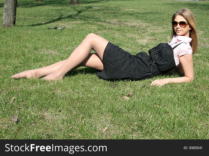 Girl lying on grass in a park