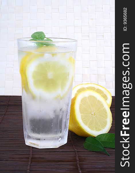 Glass of clean fresh water with lemon