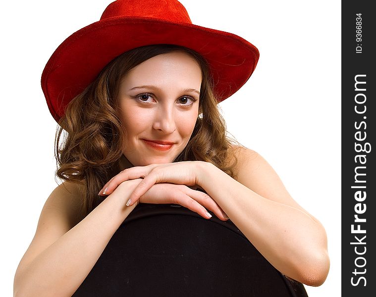 Portrait of young beautiful girl in a red hat. Isolation on a white background