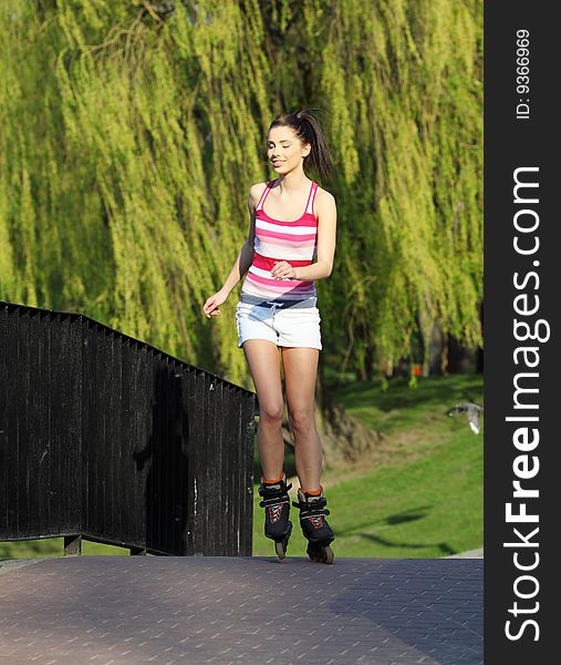 Smiling fitness woman.  over green  park background