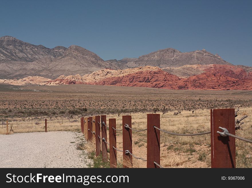 Red Rock Canyon Las Vegas Nevada with fence leading to mountains. Red Rock Canyon Las Vegas Nevada with fence leading to mountains