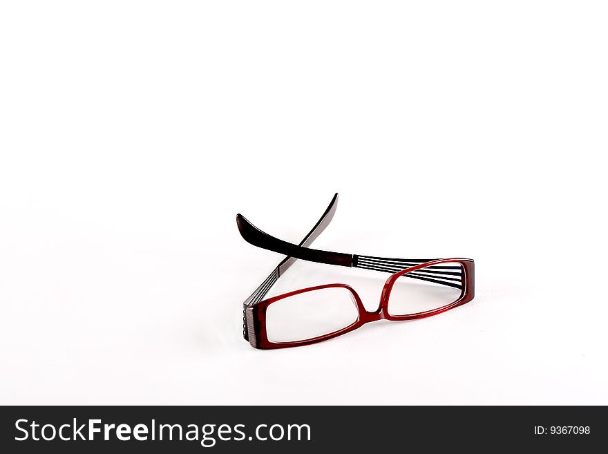 Isolated dioptric dark red glasses on white. Isolated dioptric dark red glasses on white