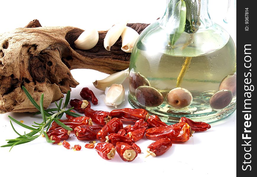 Oil, garlic, and chillies on white background