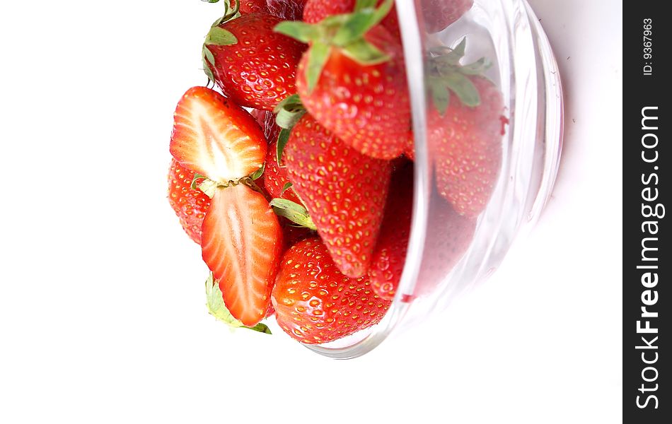 Bowl full of strawberries on a white background. Bowl full of strawberries on a white background