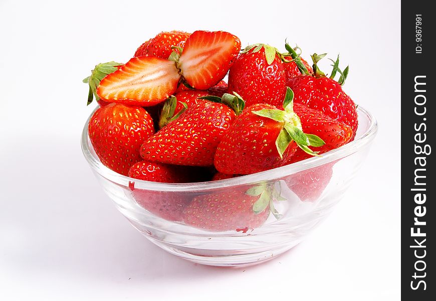 Bowl full of fresh strawberries on a white background. Bowl full of fresh strawberries on a white background