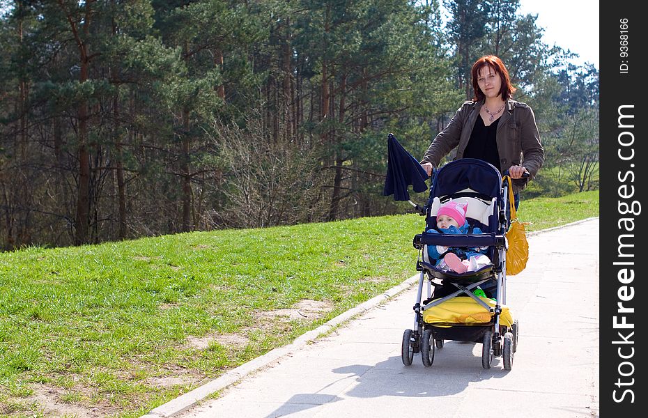 Woman and her baby outdoor. Woman and her baby outdoor
